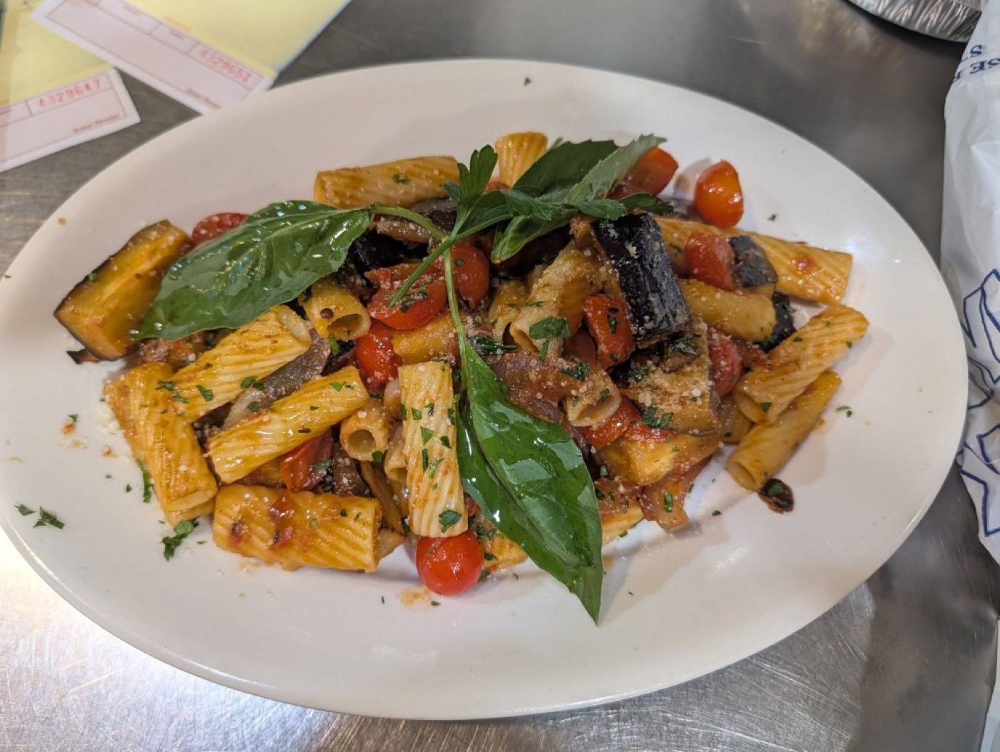 Rigatoni tossed with eggplant, cherry tomatoes, and fresh basil.